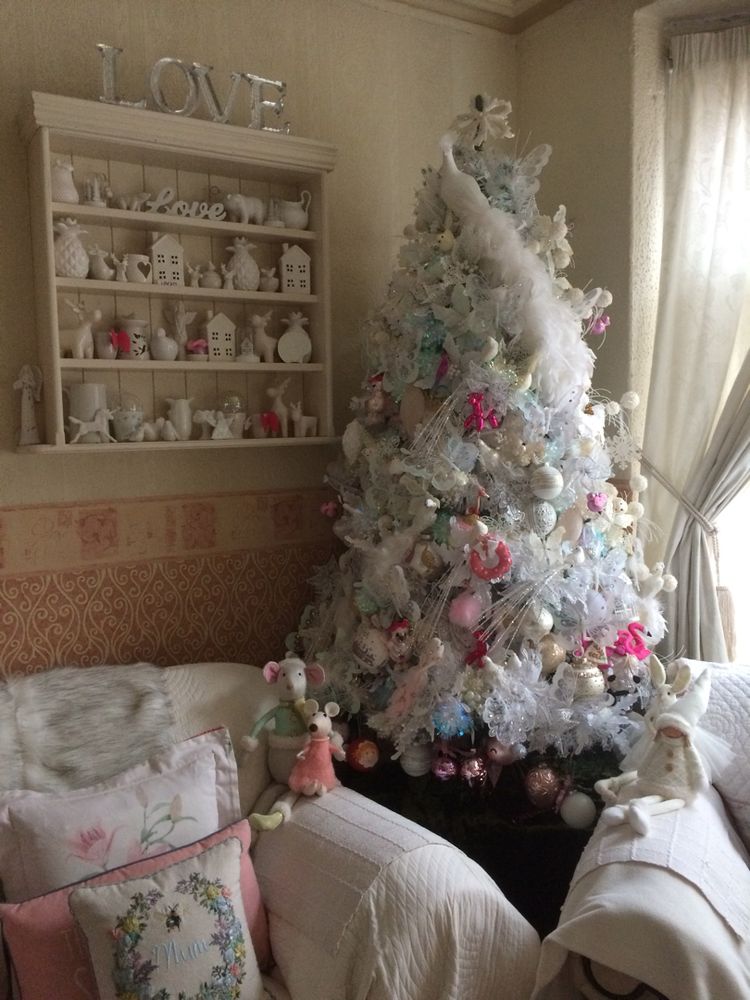 Christmas tree in the corner of the living room.