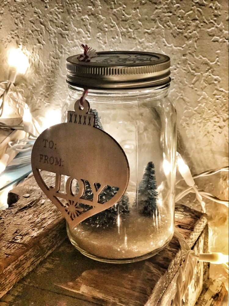 Mason jar snow globe with Christmas tree.