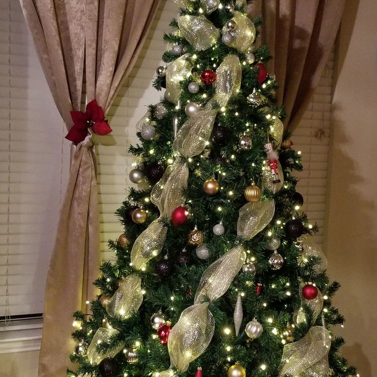 The first step in decorating a Christmas tree is adding the lights.
