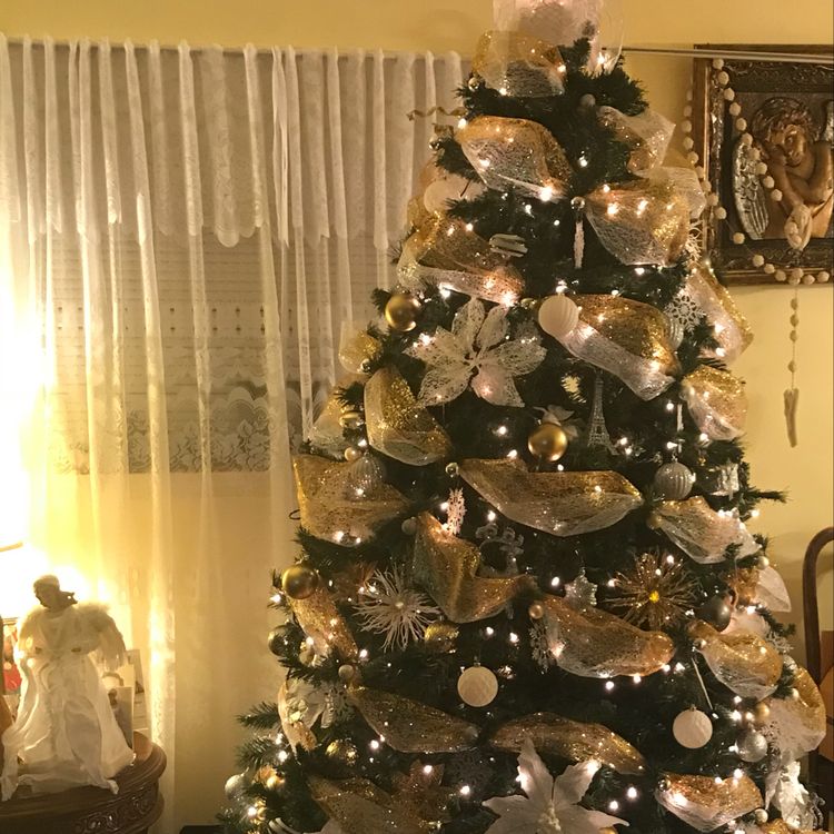 Very Beautiful Christmas Tree! Angel on the table.
