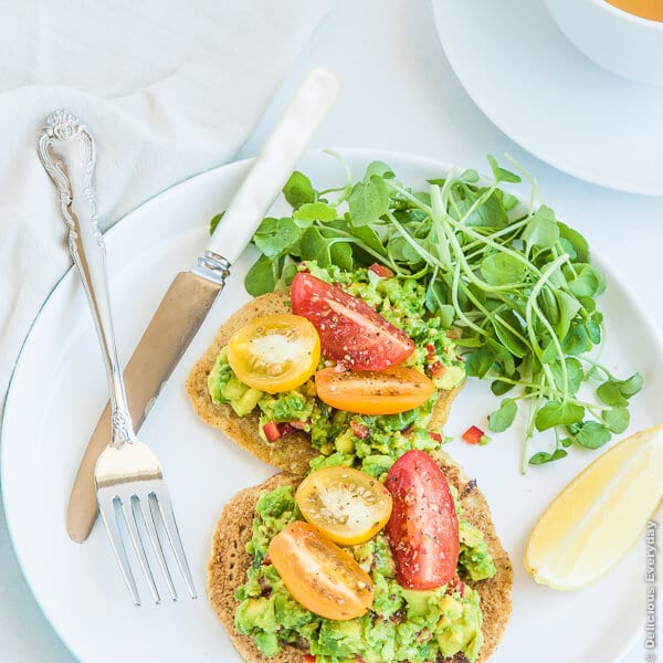 Chickpea Pancakes with Avocado, Tomato, and Watercress.