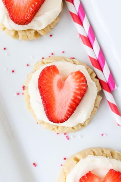 Coconut-Frosted Sugar Cookies with Strawberry Hearts.