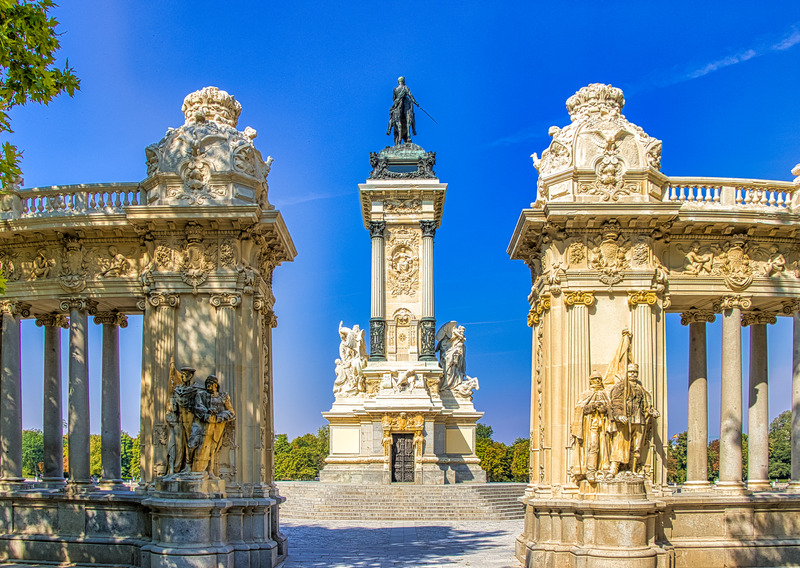 White and Black Concrete Statues Under Blue Sky