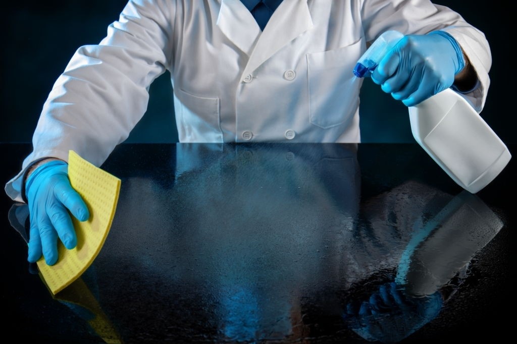 Spray clean water on the glass tabletop and wipe it a second time